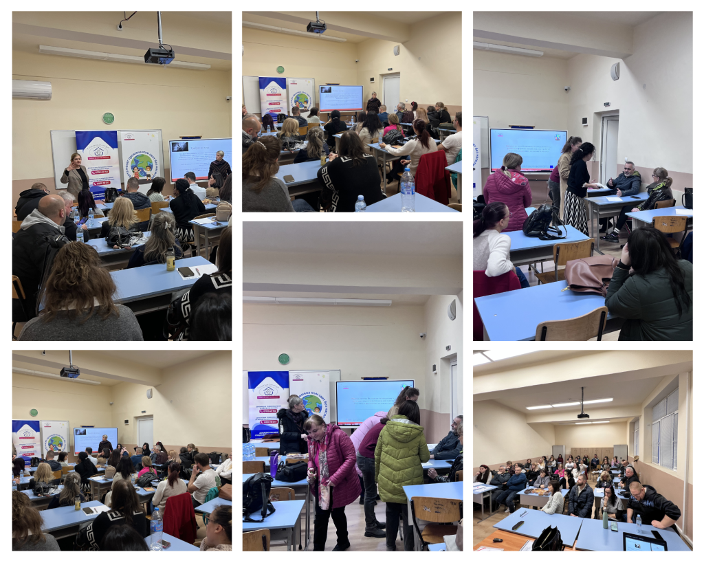 Audience seated in a classroom listening to a presenter beside a screen and banners during a seminar.