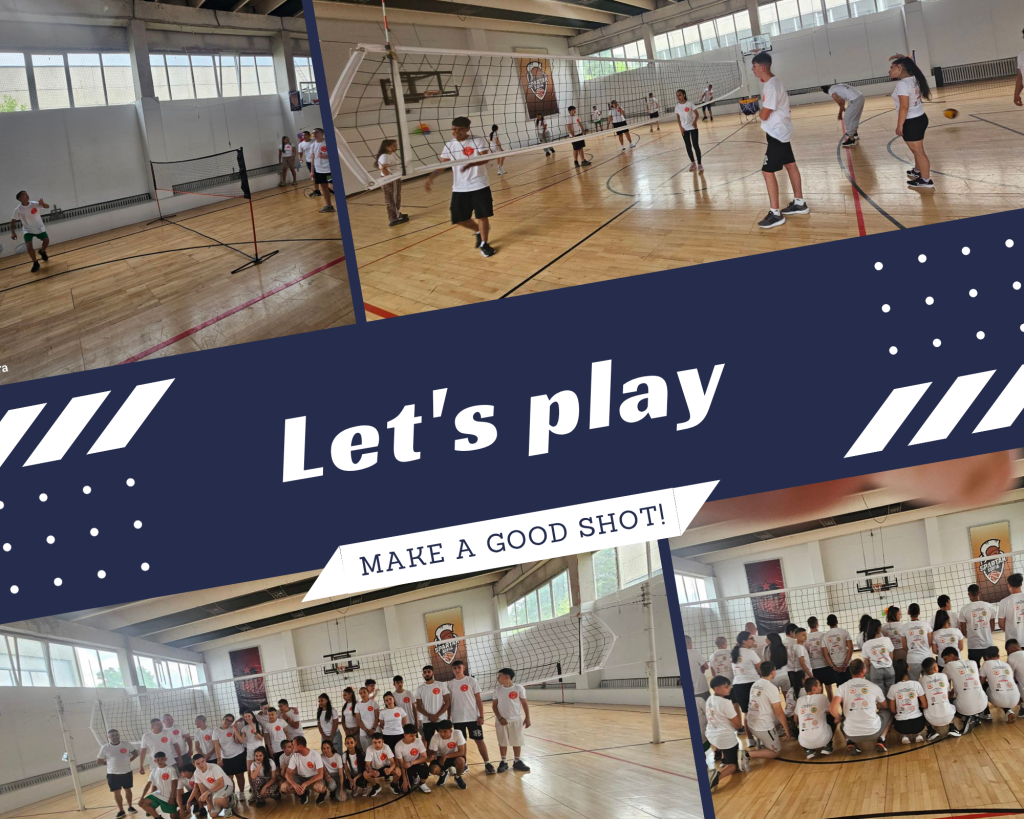 Group of children in white shirts gathered in a gymnasium around volleyball nets for a practice or activity.